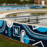 Noblesville utilities wastewater tanks and the painted murals on the side walls.