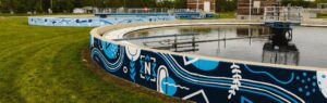 Noblesville utilities wastewater tanks and the painted murals on the side walls.